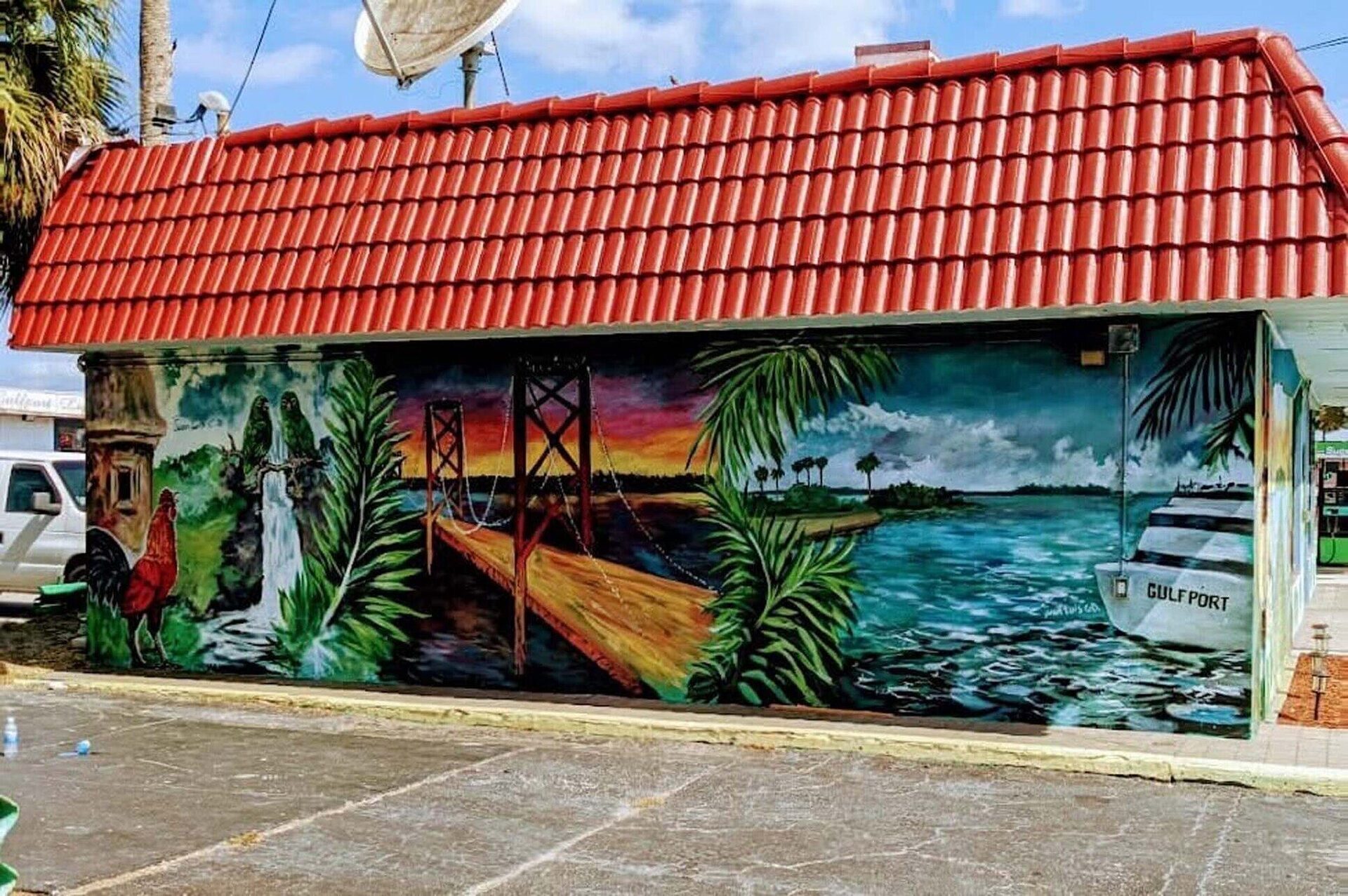 Julio's Empanadas restaurant exterior with Gulfport mural